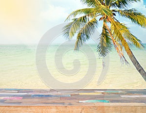 Empty wooden with coconut tree and sea background.