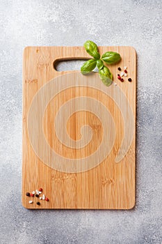 Empty wooden cutting board on kitchen table. Top view copy space