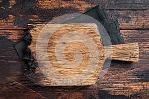 Empty wooden Cutting board over towel on kitchen table, healthy cooking background. Wooden background. Top view. Copy