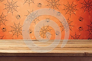 Empty wooden deck table over halloween wallpaper