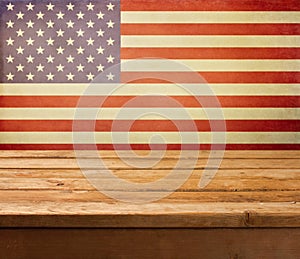 Empty wooden deck table over USA flag background. Independence day, 4th of July background.