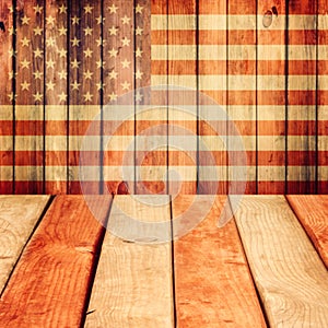 Empty wooden deck table over USA flag background. Independence day, 4th of July background