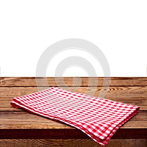 Empty wooden deck table with tablecloth