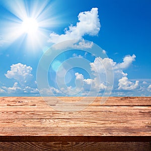 Empty wooden deck table with tablecloth