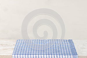 Empty wooden desk table and red checked