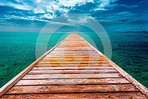 Empty Wooden Dock Over Tropical Blue Water