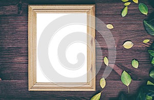 Empty wooden frame on brown wood surface