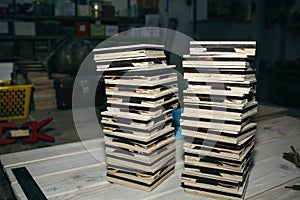 Empty wooden frames and boxes lying on the big pile. Handmade working process