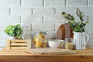 Empty wooden log on kitchen table over white brick wall background. Kitchen mock up for design and product display