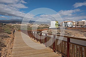 Empty wooden passage connecting the San Blass resort to the fishing village known as Los Abrigos, Canary Islands, Spain photo