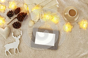 Empty wooden photo frame over cozy and warm fur carpet. For photography montage. Top view.