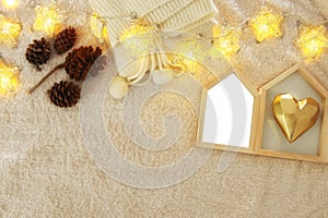 Empty wooden photo frame over cozy and warm fur carpet. For photography montage. Top view.