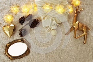 Empty wooden photo frame over cozy and warm fur carpet. For photography montage. Top view.