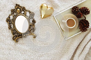 Empty wooden photo frame over cozy and warm fur carpet. For photography montage. Top view.