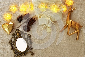 Empty wooden photo frame over cozy and warm fur carpet. For photography montage. Top view.