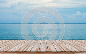 Empty wooden pier with beautiful blue sea background for montage products display