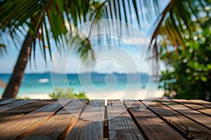 Empty wooden planks table against a blurred background with a sea coast with palm trees during the day