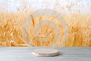 Empty wooden podium on white table over wheat field background. Jewish holiday Shavuot mock up for design and product display