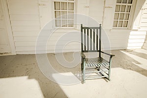 Empty Wooden Rocking Chair On Porch