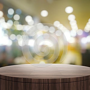 Empty wooden round table and blurred background