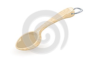 Empty wooden rustic spoon with metallic d-ring hung. Plastic kitchen ladle, bailer for measuring. photo