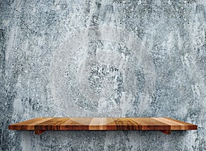 Empty wooden shelfs on grunge grey stone wall, Mock up template