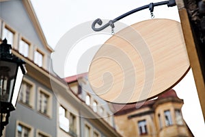 Empty wooden signboard on a european street. Architectural detail