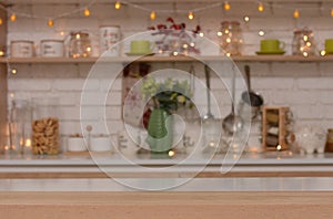 Empty wooden table on background of christmas kitchen.Copy space for text