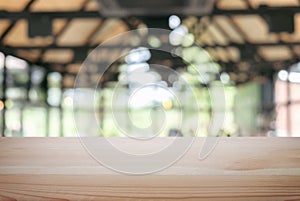 Empty wooden table and blur background of abstract in front of r