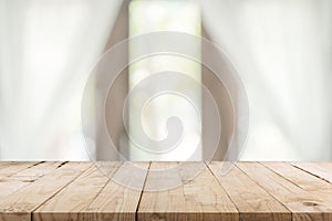 Empty wooden table and blur window background with copy space, display montage for product
