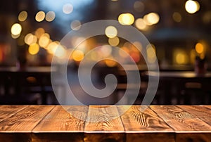 Empty wooden table and blurred background of bar or pub of bokeh lights. Ready for product display montage.