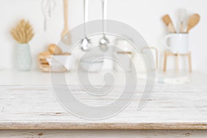 Empty wooden table on blurred kitchen accessories background, copy space