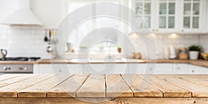 Empty wooden table with blurred kitchen interior