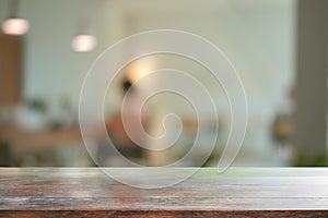 Empty wooden table with blurred living room in background. For montage product display.