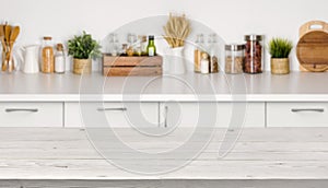 Empty wooden table with bokeh image of kitchen bench interior