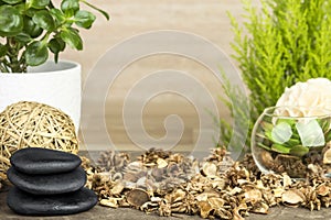 Empty wooden table decorated with organic things, stones, plants