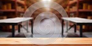 Empty wooden table on defocused blurred shelves in warehouse background