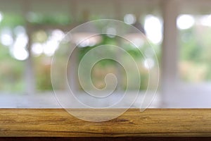 Empty wooden table in front of abstract blurred Cafe, restaurant. For montage product display or design key visual layout