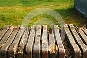 Empty wooden table with garden bokeh for a catering or food background with a country outdoor theme,Template mock up for display