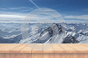Empty wooden table and ice mountain