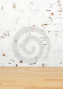 Empty wooden table over grunge cement wall