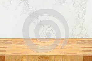 Empty wooden table  over marble wall background. Kitchen counter top for mock up design