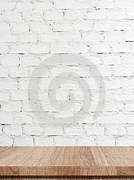 Empty wooden table over white brick wall background