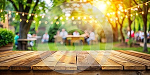 Empty wooden table with party in garden background blurred photo