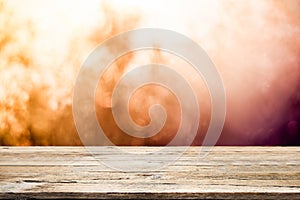 Empty wooden table for present product on bokeh background.