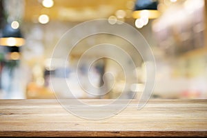 Empty wooden table for present product on coffee shop or soft dr