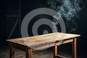 Empty wooden table with smoke float up on dark background photo