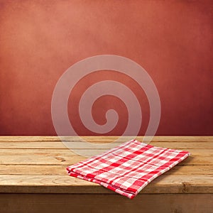 Empty wooden table with tablecloth for product montage display