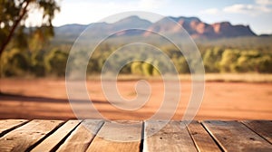 The empty wooden table top with blur background of Australian outback. Exuberant.