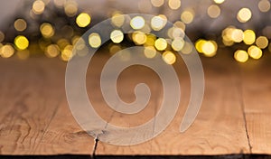 empty wooden table top with blurred light gold bokeh abstract background. For montage product display or design key visual layout